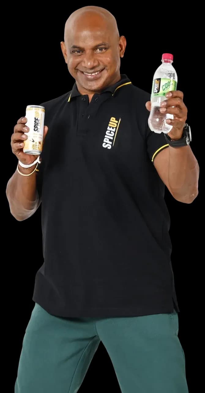Brand ambassador holding SPICEUP Cream Soda and Cool