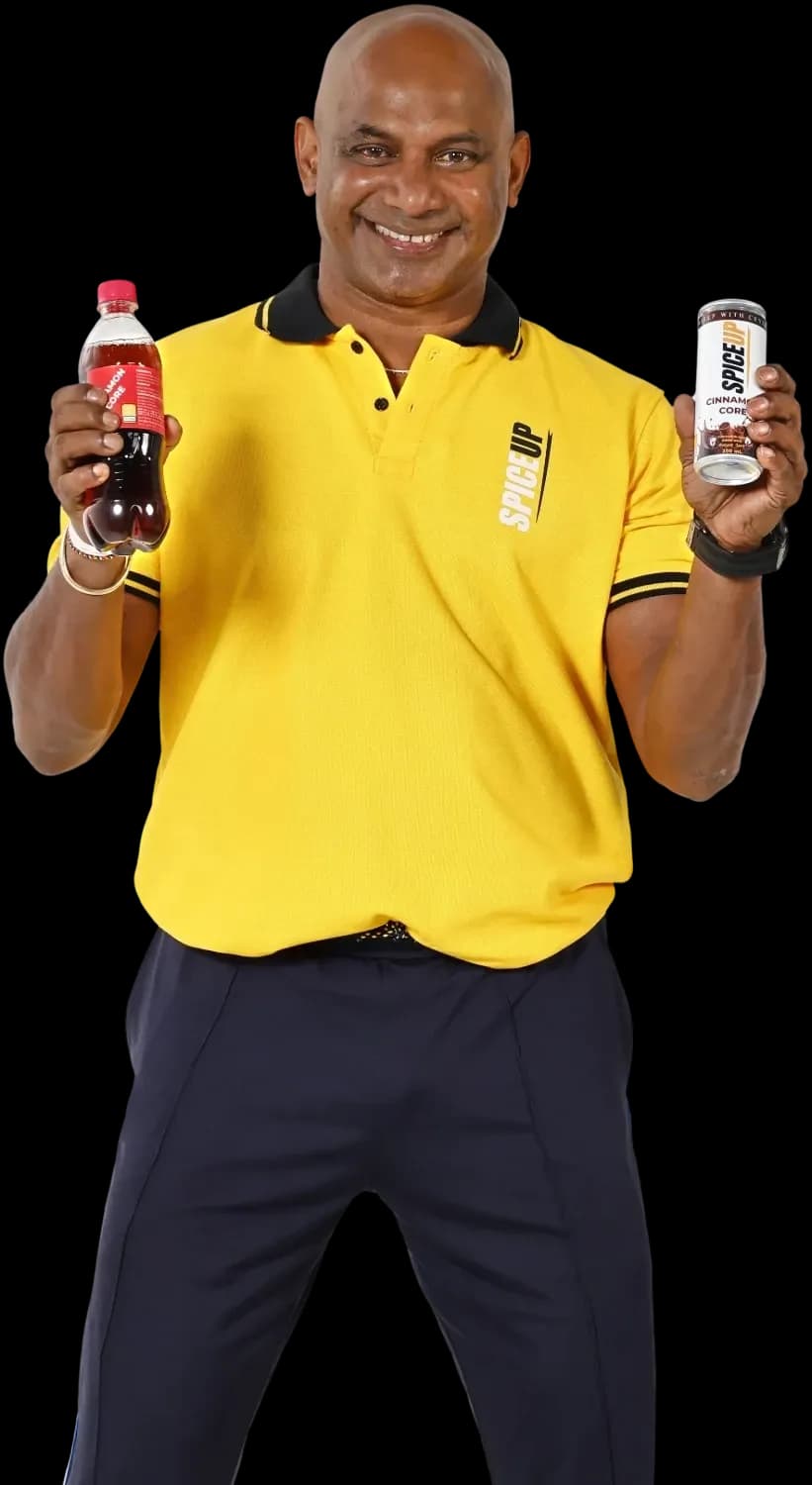 Brand ambassador holding a Cinnamon Core bottle and can