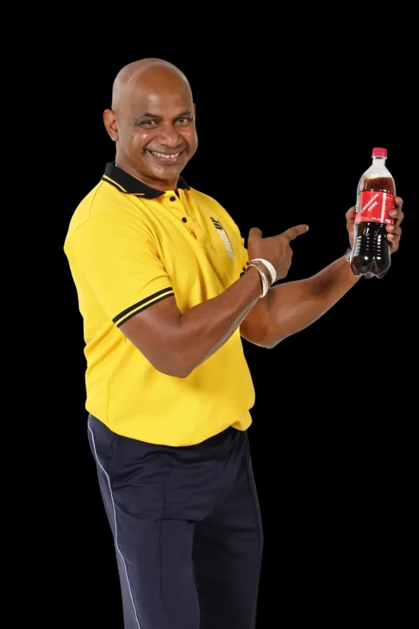 Brand ambassador pointing at a 750ml Cinnamon Core bottle